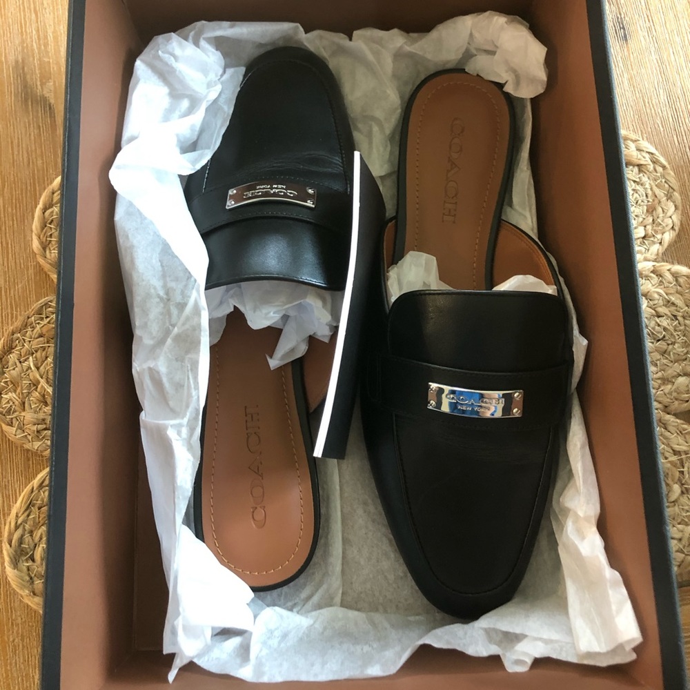 Size 8.5 black coach mules. Never been worn.